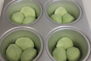 Put 3 balls of dough in each cavity. 